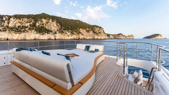 Relaxing sunbed at the aft deck of Dawo with scenic coastal views and stylish design.