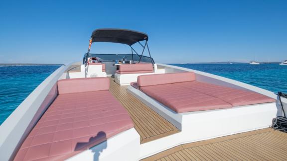 The comfortable sunbathing areas on the aft deck of the Tequila motor yacht provide a relaxing retreat.