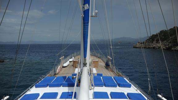 The spacious sun deck of the Gulet Prenses Lila with blue sunbathing areas.