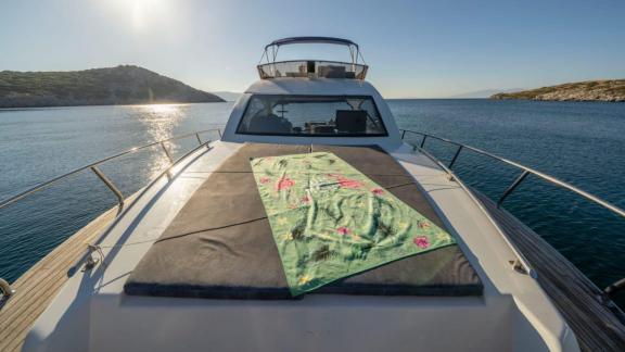 Foredeck of motor yacht Moonlight, a tranquil evening at sea.