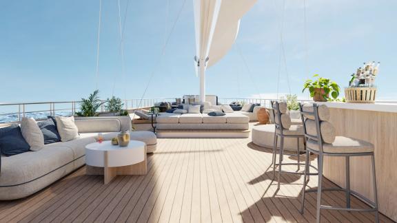 Outdoor deck with comfortable sofas, bar, and plants on a yacht in sunny weather.