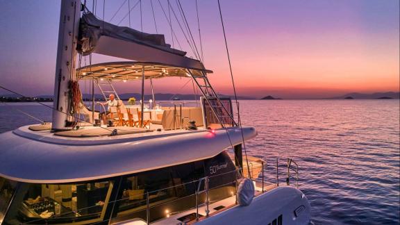 The flybridge of Adara yacht offers a romantic atmosphere at sunset.