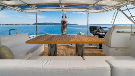 In Kastela Zara’s flybridge features cushioned seating table and a sea view helm.