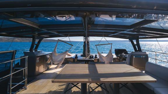 Ahalya charter Sunreef 60 catamaran offers hammocks and lounge area on the flybridge.