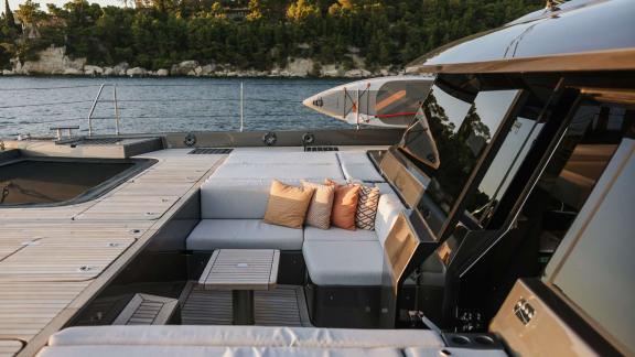 Ahalya charter Sunreef 60 catamaran has cushioned seating and tables on the foredeck.