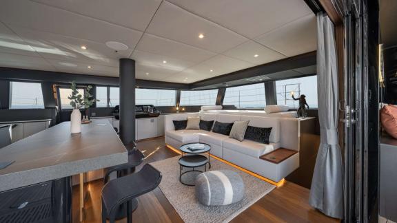Ahalya charter Sunreef 60 catamaran offers a sleek saloon with panoramic windows.