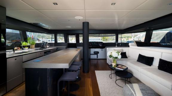 Ahalya charter catamaran features a spacious galley and elegant lounge for premium onboard living.