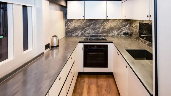 Sunreef 60 Mr. Si offers a sleek galley with stainless steel counters, built-in oven and smart storage spaces.