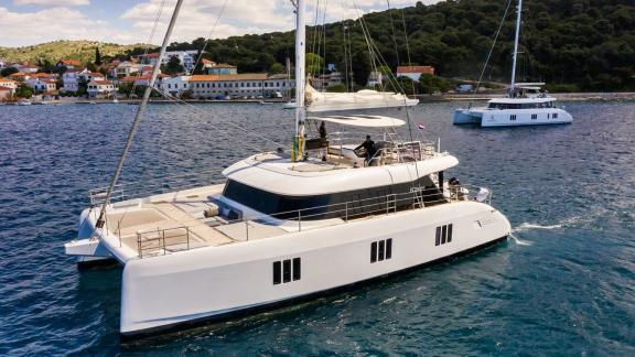 Sunreef 60 catamaran Mr. Si sails off Rogoznica, drawing attention with her elegant and modern exterior.