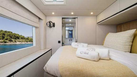 Guest cabin of the Sunreef 60 Sea Dreams catamaran off the coast of Split, Croatia, offering comfortable accommodation a