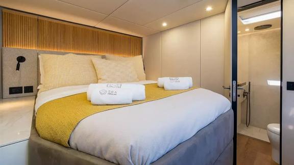 Guest cabin of the Sunreef 60 Sea Dreams catamaran in Split Marina, Croatia, offering comfortable accommodation at sea.