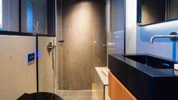 Amber One features a sleek and minimal bathroom design near the coast of Kastela.