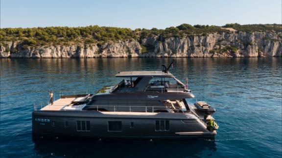 Luxury catamaran Amber One Sunreef 70 anchored in calm waters off Kastela.