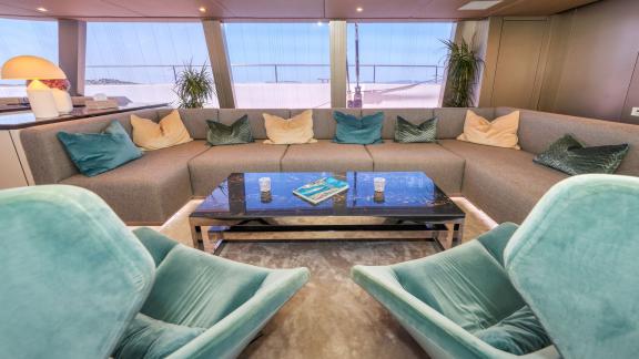 Plush seating and elegant décor create a refined indoor space aboard Honeybird for luxury charter in Šibenik.
