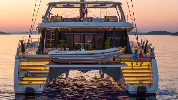 Illuminated at sunset, Honeybird offers couples a luxurious charter experience near Šibenik.