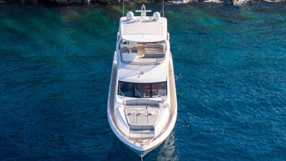 The Sunseeker 75 is anchored in clear blue waters off Split with a front-facing angle.