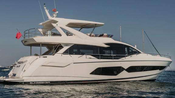 Lady M motor yacht is anchored in calm waters off the coast of Mallorca.