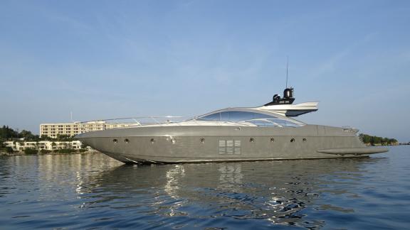 The modern and luxurious yacht Super Toy peacefully cruising on the open sea on a sunny day.