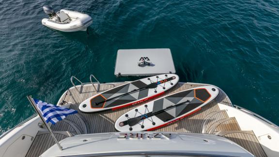 Watersports equipment and an inflatable boat on the aft deck of the yacht Azure.