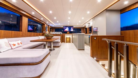 The spacious and modern interior of Floki trawler yacht offers comfortable seating and stylish decor.