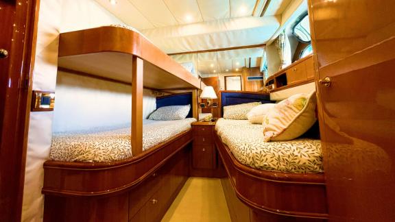 The triple cabin of motor yacht Riva 21 features comfortable beds and a cozy atmosphere.