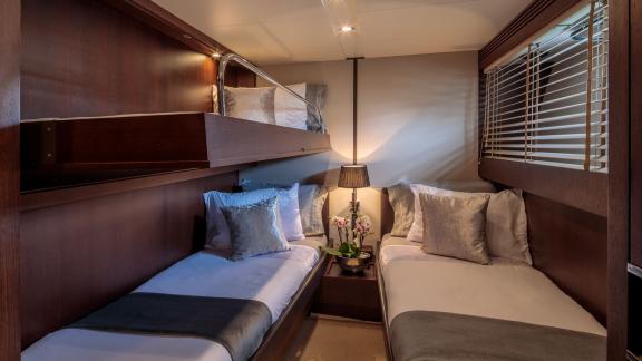 Comfortable triple cabin on yacht Miraval with elegant details.