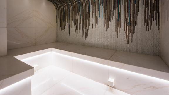 Steam room on the Opari yacht with marble benches and a relaxing atmosphere.