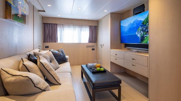 Relax in the elegant living room of Motor Yacht Summer Fun with a large TV and comfortable sofas.