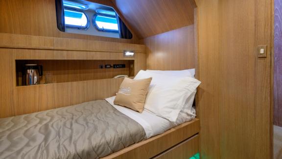 Enjoy a peaceful vacation in the comfortable single cabin of Sandi IV with an Italy motor yacht rental.