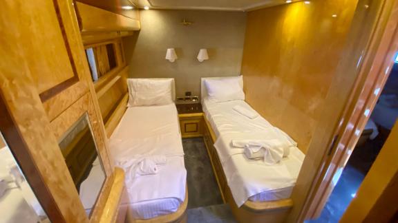 Twin bed cabin on motor yacht Ser 1 provides an elegant and cozy resting area.