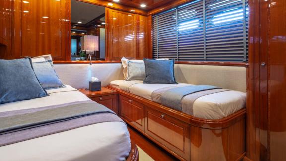 The twin cabin of Divine yacht features elegant details and comfortable beds.