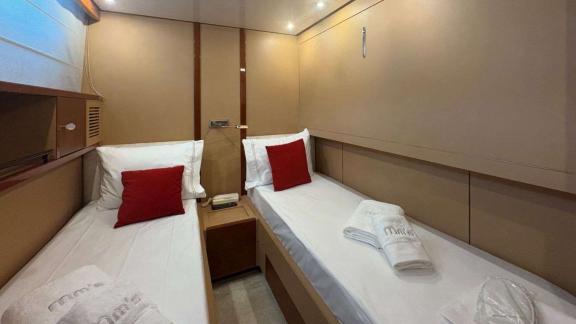 Among Athens yacht options twin guest cabin of Mammas motor yacht with two single beds.
