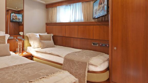 Comfortable twin cabin on the 30-meter Motor Yacht Martina, ideal for guests in Greece.