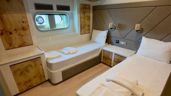 Modern and spacious cabin with two beds on Angelo 3 yacht.