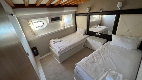 The cabin on Angelo 2 yacht offers two comfortable single beds and a modern design.