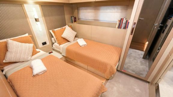 The twin guest cabin on yacht La Luna offers an elegant design and comfortable beds for a relaxing stay.