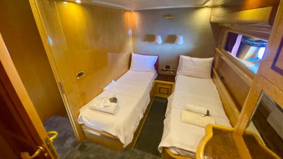 Twin bed cabin on motor yacht Ser 1 offers comfortable accommodation.