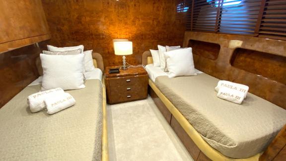 The twin cabin on Paula 3 yacht features comfortable beds and stylish decor.