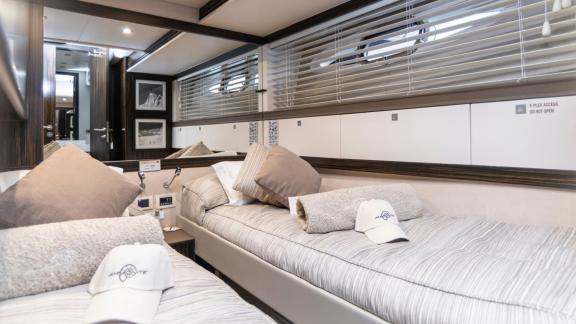 The stylish and comfortable twin bed cabin on the Ammonite yacht is equipped with modern details.