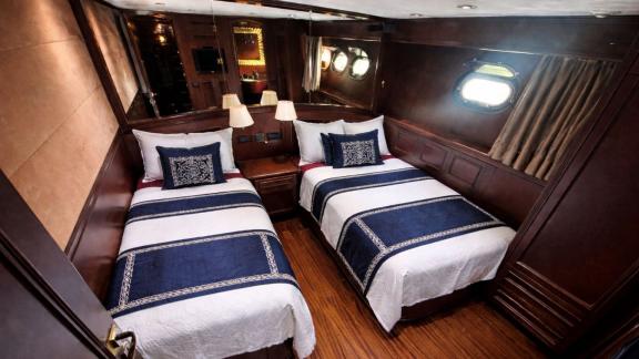 Among Göcek yacht charter options the 5 cabin 10 guest River Storm motor yacht features a twin guest cabin with separate