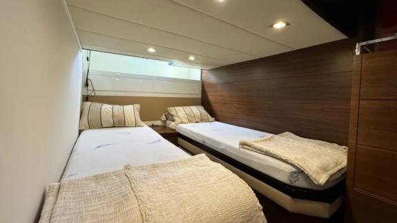 The single cabin on motor yacht Breathe features two separate beds.