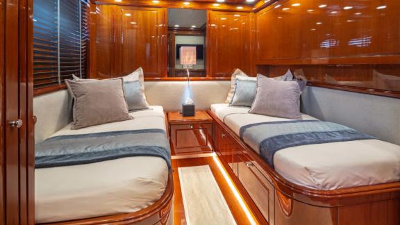 The twin cabin of Divine yacht offers comfortable beds and modern decor.