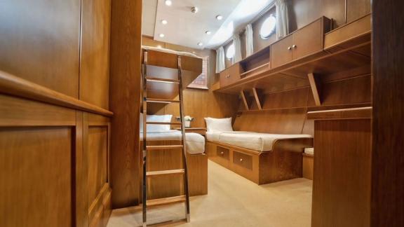 Comfortable triple cabin on gulet Arktos with three beds.