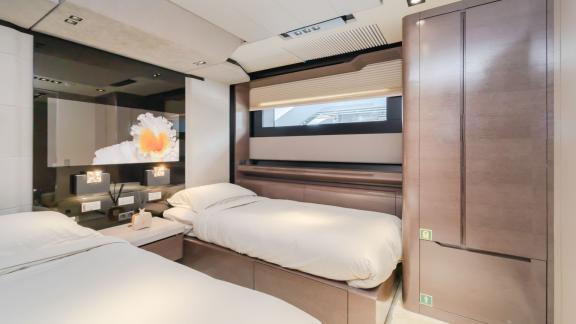 The guest cabin of the Saffuriya yacht offers a simple and comfortable sleeping area.