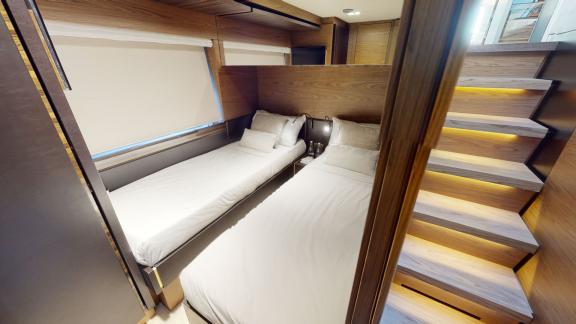 The twin bed cabin of the Ferretti 670 motor yacht provides comfort for your Dubai yacht rental experience.