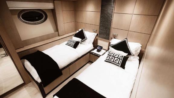 The twin-bed cabin on Ak Royalty yacht offers a stylish and comfortable stay.