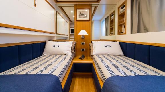 Cozy and stylish cabin with Naples motoryacht charter.