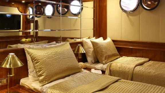 The twin cabin of Queen Atlantis is furnished with elegant details and comfortable beds.