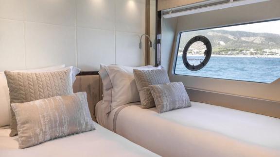 The twin cabin of Lady M in Mallorca features two separate beds with window view.