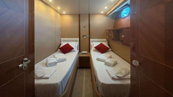 Among Athens yacht options twin guest cabin of Mammas motor yacht with two single beds.